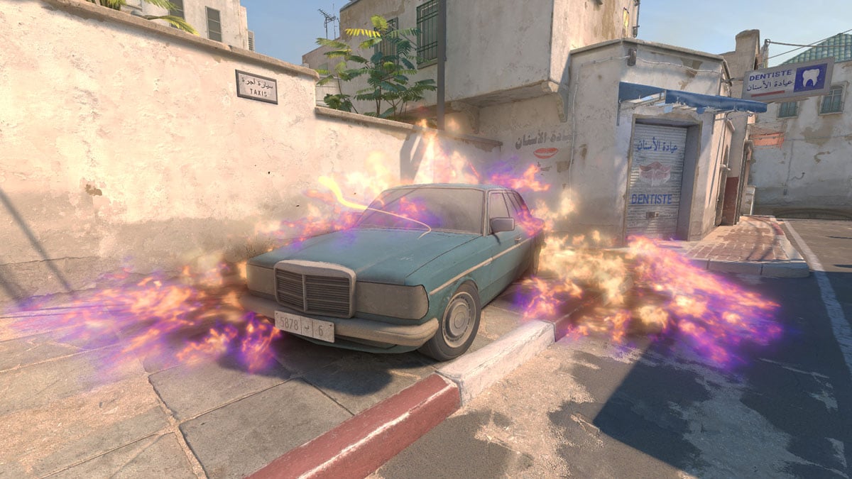 A car on fire on A Long on Dust 2 in CS2.