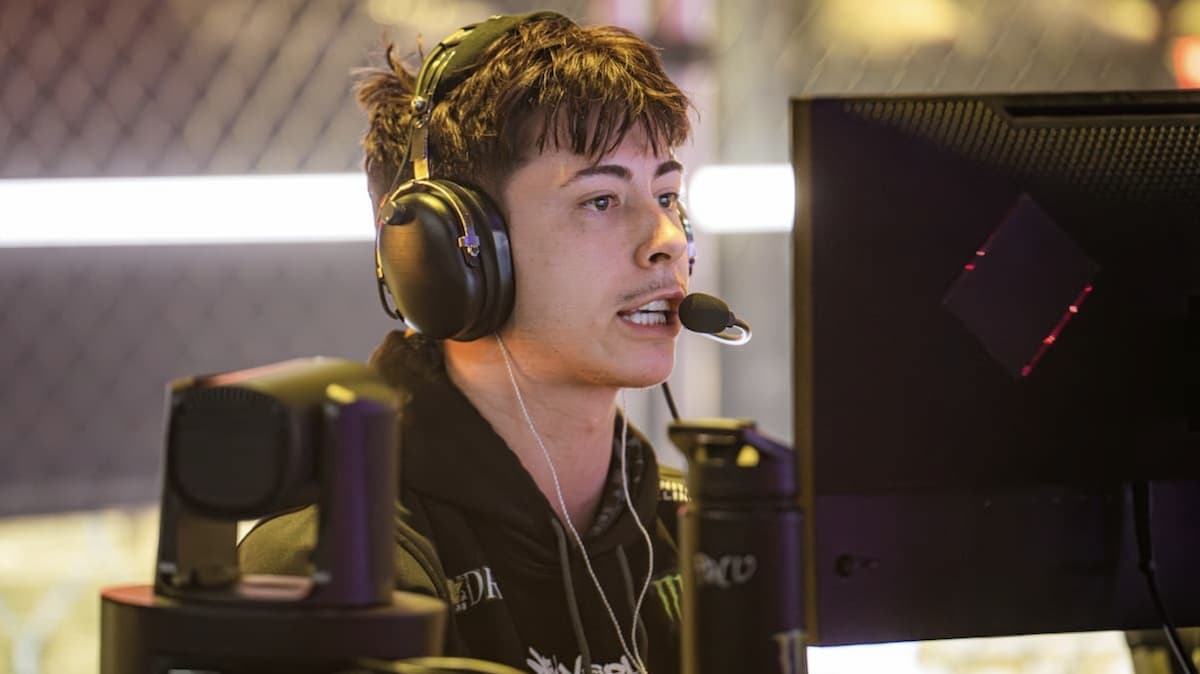 CoD pro HyDra wearing a headset, intensely looking at the monitor in front of him.